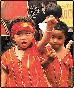 Children form a part of a demonstration by Burmese nationals in New Delhi on Monday on the 55th birthday of their imprisoned leader Aung San Suu Kyi.  Photo by Sondeep Shankar 