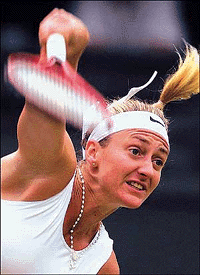 France's Mary Pierce serves to Magui Serna of Spain during their second round match at the Wimbledon Tennis Championships, on Thursday. The tournament climaxes with the finals on July 9.
