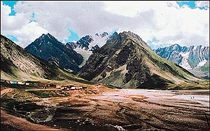 Yatris cross the breath-taking Panjtarni valley to reach the cave