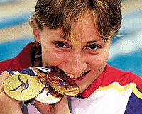 Russian-born Spanish swimmer Nina Zhivanevskaya celebrates her third gold medal after victory at women's 50m backstroke Final at the European Swimming Championships at Helsinki's Makelanrinne Swimming Center on Sunday