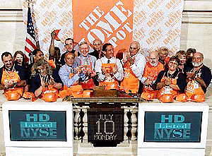 New York Stock Exchange Chairman Richard Grasso, third from left front, Home Depot Chairman Bernie Marcus, left centre, Home Depot CEO and President Arthur Blank, centre, and Co-Founder Ken Langone, right centre, applaud after ringing the opening bell at the NYSE on Monday, celebrating their 1000th store. AP/PTI photo