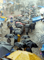 Scores of stranded office-goers making their way through flooded Dadar areas