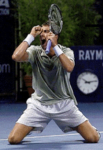 Justin Gimelstob from Livingston, N.J., reacts after upsetting Mark Philippoussis of Australia, 3-6, 7-6(7-5), 7-6(7-3), during the second round of Mercedes-Benz Cup on Thursday in Los Angeles.  AP/PTI