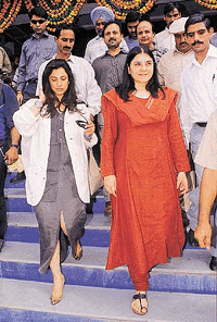 Dimple Kapadia and Maneka Gandhi leave a garments store, Meena Bazaar, Mani Majra, after launching the use of paper bags in the shop on Friday
