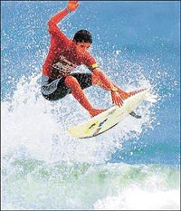 Brazilian Marcelo Nunes performs an aerial surfing manoeuvre to advance to the round of 64 surfers in the US Open of Surfing at Huntington Beach in California on Thursday. Nunes advanced alongside compatriot Tanio Barreto and the pair will now face Hawaiian Kalani Robb and South African Paul Canning in their next heat. Reuters