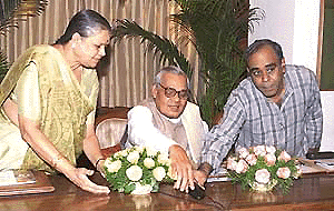 Prime Minister Atal Behari Vajpayee inaugurating Powergrid Corporation optical fibre network between Delhi and Chandigarh from his residence in New Delhi on Wednesday. Union Power Minister of State for Power Jayawanti Mehta are also seen in the picture.  PTI photo