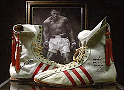 Muhammad Ali's boxing shoes from the first Ali-Frazer fight in March 8, 1971, sit on display at Butterfield's & Butterfield's, an ebay company, on Friday, in Los Angeles to be auctioned on August 12 at Dodger Stadium. Starting bid is expected to be between $1,00,000 and $1,50,000. 