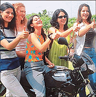Models lend charm to Suzuki Fiero, a 150cc, 4-stroke motor cycle, launched in Panchkula on Wednesday. Its D-fi Logic technology  digital fuel ignition and linear oscillations governed intelligent carburettor  has not been used on two-wheelers in  India  before,  Suzuki  claims.  It costs Rs 51,360 in Chandigarh  Tribune photo by Manoj Mahajan