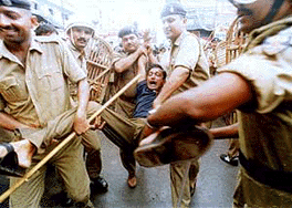 The police arrests a CPI-ML activist in Patna on Saturday. The CPI-ML workers were blocking a road in protest against alleged police atrocities