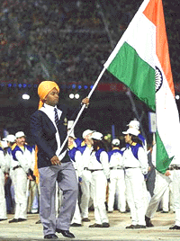 Flag bearer Leander Paes leads the Indian Olympic Team into Olympic Stadium.
