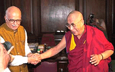 Tibets exiled spiritual leader, the Dalai Lama (right), talks to Union Home Minister L. K. Advani in New Delhi on Saturday. 