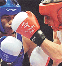 India's Dingko Ngangom Singh (L) fights Ukraine's Serguey Daniltchenko in their 54 kg boxing bout at the Sydney Olympic Games on Thursday. Daniltchenko won the bout on points.  Reuters  Photo