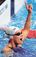 Dutch swimmer Inge de Bruijn gestures after setting a new world record during a semifinal of the womens 50-metre freestyle event at the Olympic Games on Friday.