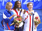 USA's Venus Williams, center, displays her gold medal while Russia's Elena Dementieva, left, holds the silver and USA's Monica Seles holds the bronze during the medals ceremony in Olympic women's singles tennis .