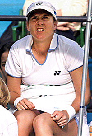 Monica Seles of the USA grimaces in pain as she gets a massage from a trainer during the second set of the semi-final of the womens singles on Saturday.