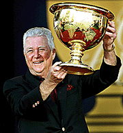 American team captain Ken Venturi holds the President's Cup following his team's victory at the Robert Trent Jones Golf Club in Lake Manassas, on Sunday. 