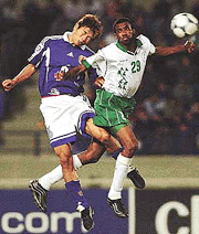 Japans Toshihiro Hattori (left) jumps for the ball against Saudi Arabias Talal al-Meshal during the final soccer game between Saudi Arabia and Japan for the Asian Cup 2000 in Beirut, Lebanon, on Sunday.