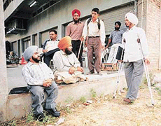 A hard time for the candidates: Due to the lack of proper arrangements physically challenged candidates, coming for the interview for the post of Food Supply Officer seen sitting in the corridors in front of the PUNSUP office. 