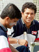 Indian cricket star batsman Sachin Tendulkar (right) speaks with his team skipper Sourav Ganguly as they prepare to practice batting at Bangabandhu National Stadium, on Wednesday in Dhaka . 