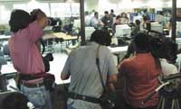 Media cover a recount of Florida's six million ballots. Reuters