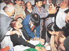 Capt Atul Sharmas grieving mother (second from left) along with relatives soon after his body was brought to his residence in Chandigarh from Jammu, on Friday.