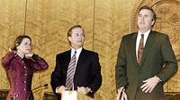 Floridas Secretary of State Katherine Harris (left), along with Commissioner of Agriculture Bob Crawford and Florida Governor Jeb Bush (right), stand before a morning Cabinet meeting at the state capitol in Tallahassee on Thursday.