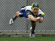 Australia's Michael Slater dives for a catch during a training session at The Gabba in Brisbane on Wednesday.