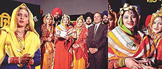 Vishav Punjaban 2000, Swaranjit Sandhu, and Aman and Poonam, the first and the second runners-ups, respectively, receive their prizes from Mr S.R. Kler, Additional Deputy Commissioner, in Ludhiana on Saturday night.