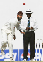 Indias Sharanjeet Singh bowls on the last day of the second Test between India and Zimbabwe which ended in a draw in Nagpur, on Wednesday. Singh picked up six wickets in the first Test of his career. 
