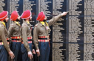 Men of the Sikh Regiment in Chandigarh look at names of soldiers who died in the 1971 war with Pakistan, on the occasion of Vijay Divas on Saturday.