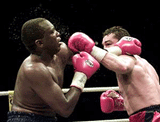 Canada's Dave Hilton Jr (R) trades punches with South Africa's Dingaan Thobela during their WBC Super Middleweight title fight in Montreal, on Friday. Hilton won the title by a split decision.