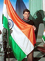 Indian Grandmaster Viswanathan Anand stands with the Tricolour on Sunday during a celebration after he won the final match of the World Chess Championship.