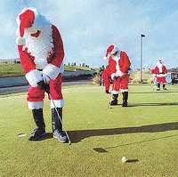 Santa Claus and his helpers take a break on Christmas morning on Monday at Quail Ridge Golf Course in Clarkston, Washington.