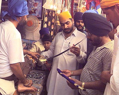 Devotees go on a shopping spree at Anandpur Sahib. Stalls selling kirpans did brisk business during the Khalsa 