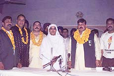 Wrestlers from Pakistan pose for a photograph with the SGPC chief Bibi Jagir Kaur at a press conference on April 10, 1999. 