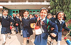 With jubilation writ large on their faces, school children return home on the first day after the winter vacation in Chandigarh on Wednesday.