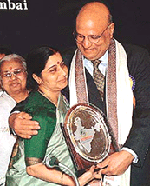 NRI Industrialist Lord Swraj Paul hugs Union Information and Broadcasting Minister Sushma Swaraj after receiving the Bharat Gaurav Award 2001 at Overseas Indian conference in Mumbai on Friday night.