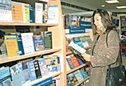 Visitors at an exhibition held by the British Council Library in Chandigarh on Tuesday.