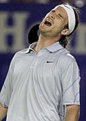 Carlos Moya of Spain reacts during his quarterfinal match against Sebastien Grosjean of France at the Australian Open in Melbourne on Wednesday.