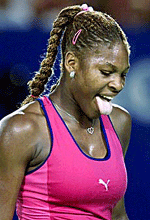 Number 6 seed Serena Williams sticks out her tongue during her quarterfinal match against Martina Hingis at the Australian Open in Melbourne on Wednesday. 
