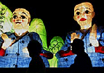 Visitors pass by lanterns representing monks in front of the Chiang Kai-shek Memorial Hall in Taipei on Saturday.