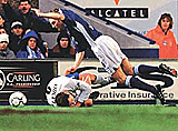 Ipswich Town's Mark Venus (right) falls over Leeds United's Mark Viduka during their English Premier Leauge soccer match at Portman Road, Ipswich, England on Saturday. 