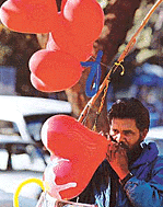 Hearts in demand: a balloon seller inflates a heart-shaped balloon in Chandigarh on Saturday as sale of such balloons picks up in view of Valentines Day.
