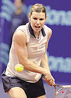 Anke Huber of Germany hits a backhand to Magdalena Maleeva of Bulgaria during their semi-final match of the Gaz de France Tennis Open at the Coubertin Stadium in Paris 
