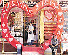 A giant Valentines Day heart frames the entrance of a shop selling romantic cards and toys in Mumbai on Monday. 