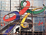 A Chinese man works on a newly-installed logo of Beijing's bid for the 2008 Olympic Games in central Beijing on Tuesday.