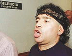Argentine soccer legend Diego Maradona walks into a Buenos Aires television studio to participate in a live broadcast on Monday