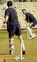 Australian batsman Ricky Ponting prepares to strike the ball sent down by Damien Martyn at the first net session of the Australian cricket team on Thursday at the MIG stadium in Bombay.