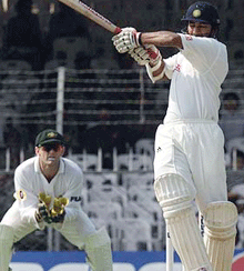 Indian A cricket teams Sadagoppan Ramesh hits the ball to the boundary off Australian bowler Michael Kasprowicz as wicketkeeper Adam Gilchrist (L) looks on during second days play of the three-day match in Nagpur on Sunday. 