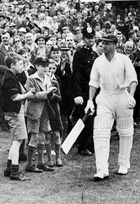 Sir Donald Bradman walks out to bat against England in the 1937 series in this file photo. 